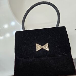 Elegant Black Velvet Handbag with Bow Accent